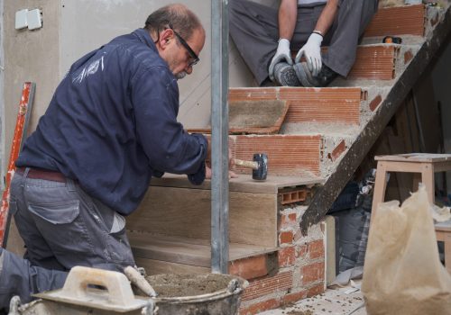 senior-bricklayer-building-a-ceramic-wood-effect-s-2026-01-09-00-34-49-utc (1)