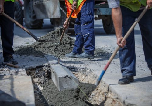 workers-with-uniforms-filling-the-hole-with-cement-2026-01-08-00-22-58-utc (1)